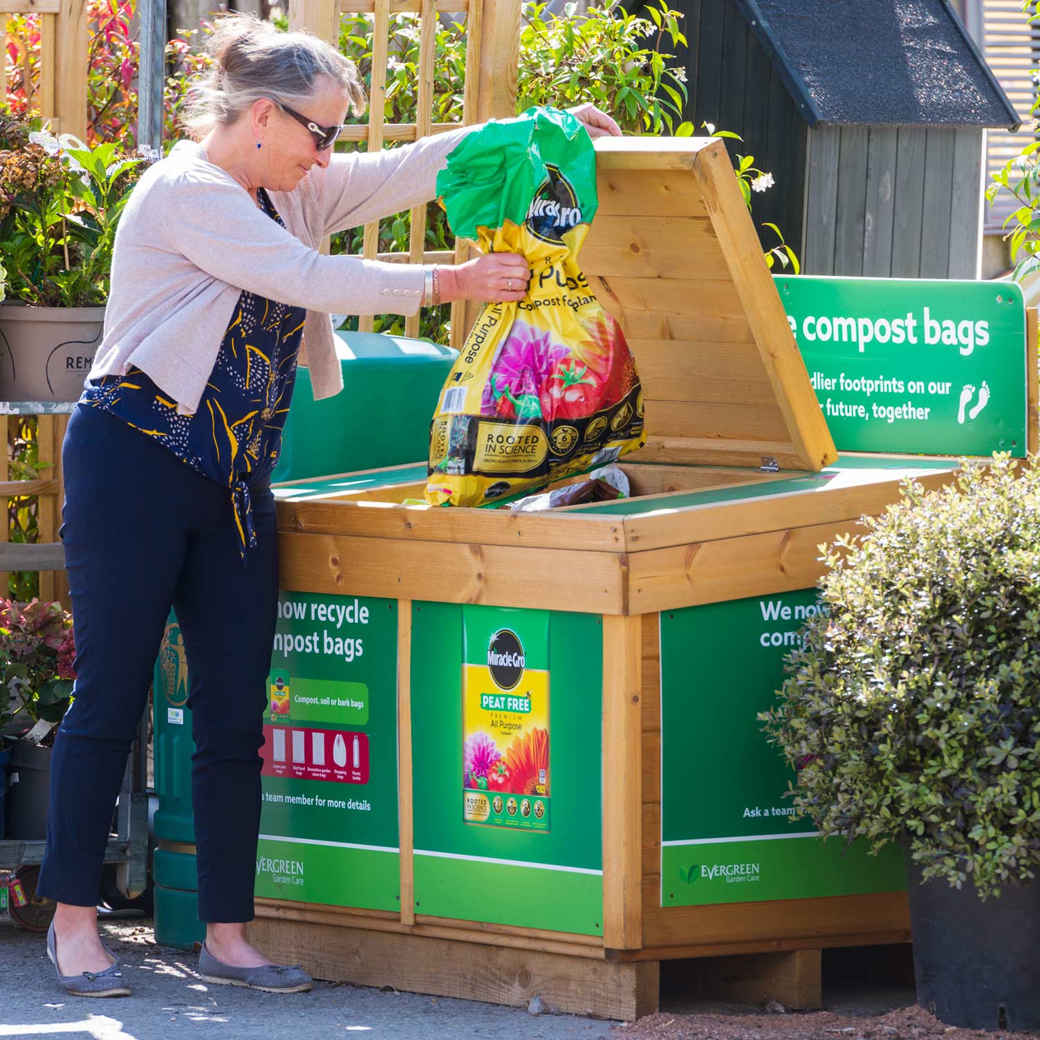 evergreen-compost-bag-recycle-bin.jpg Compost bag recycling bin in use