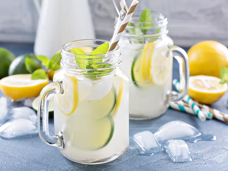 Freshly made lemonade with lemon and limes