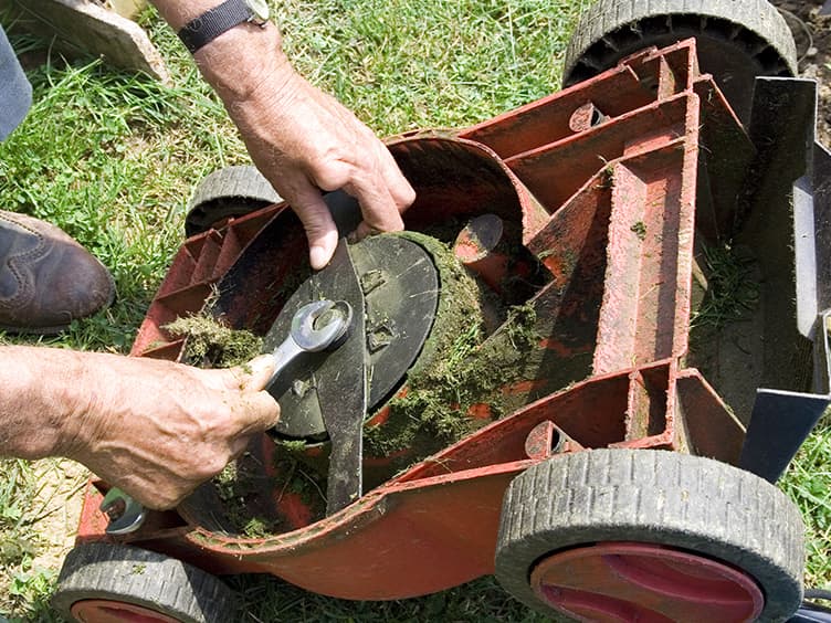 Fixing the lawn mower.