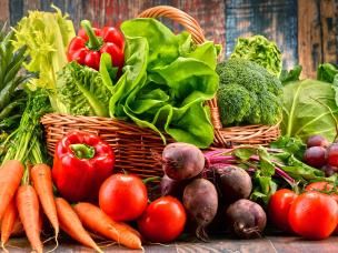 A basket overflowing with freshly picked ripe vegetables