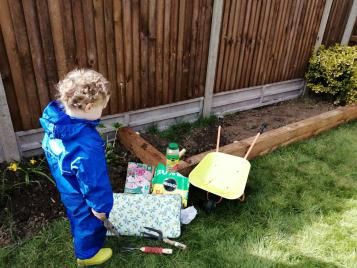 Child gardening with Miracle-Gro products
