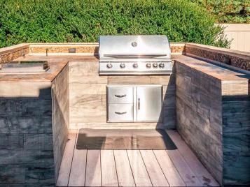 A modern contemporary wooden barbecue area