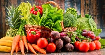 A basket overflowing with freshly picked ripe vegetables