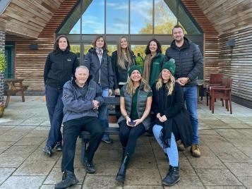 Evergreen team with a donated recycled bench