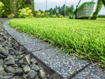 Edging a lawn for lower maintenance